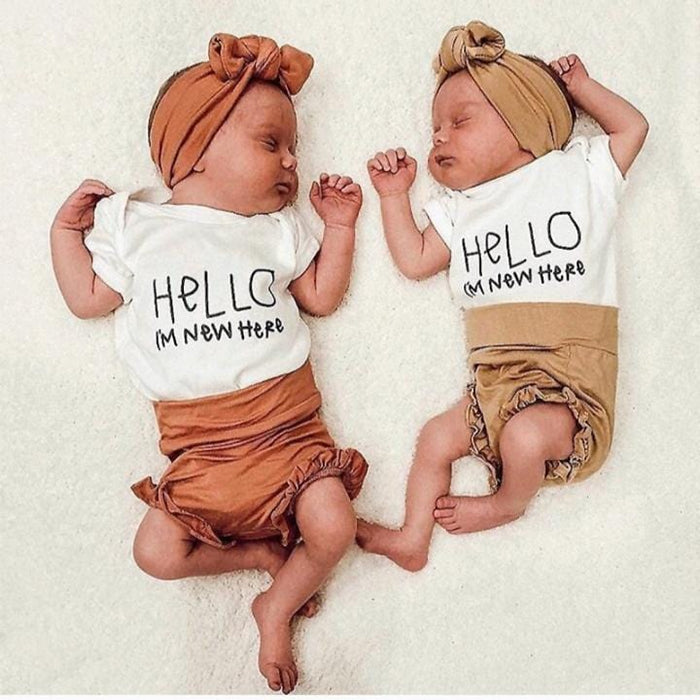 New here greeting baby onesie